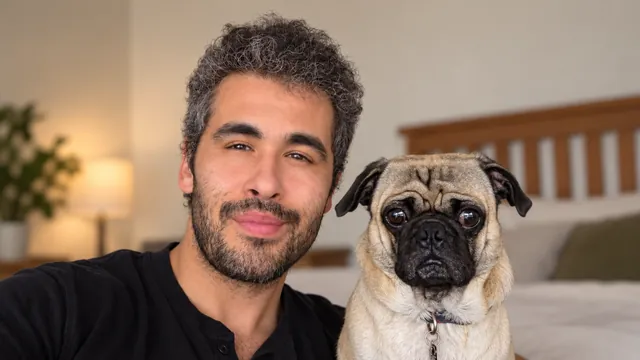 The developer behind Rebellion Company sitting beside his pug.